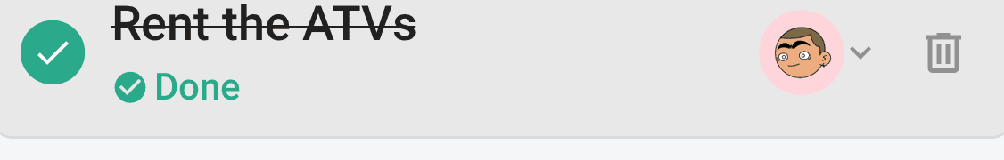 A done task, the status dot filled green with a check and the title struck through