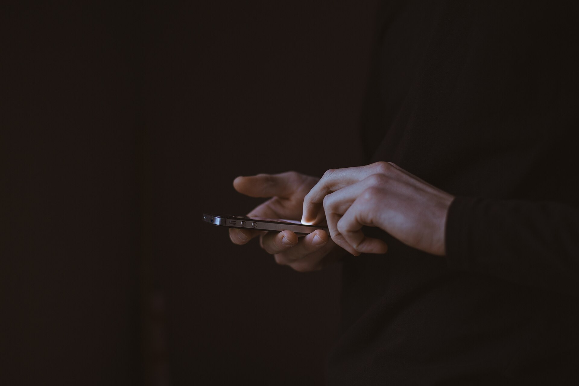 Hands using a smartphone