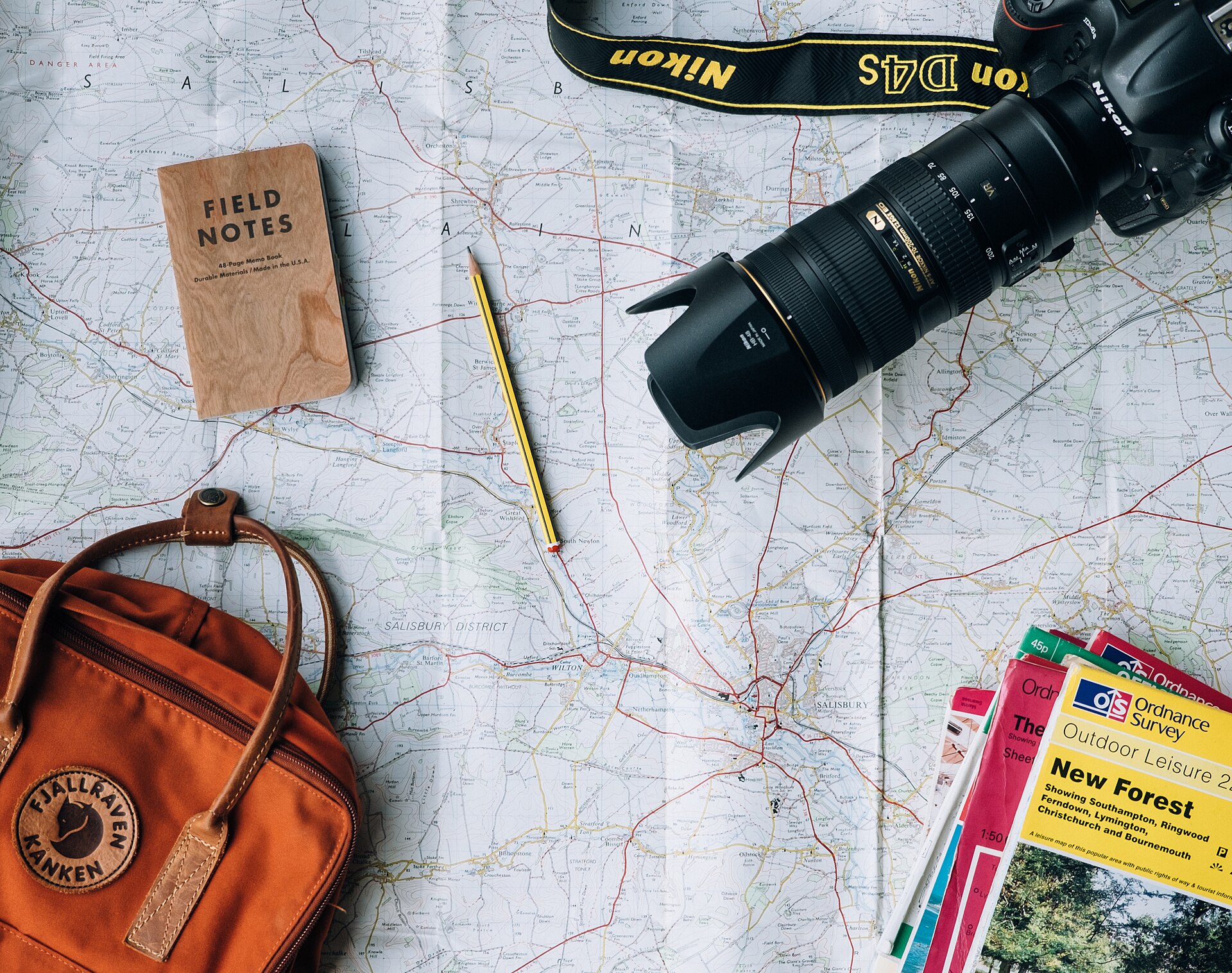 A route map with field notes, camera and backpack