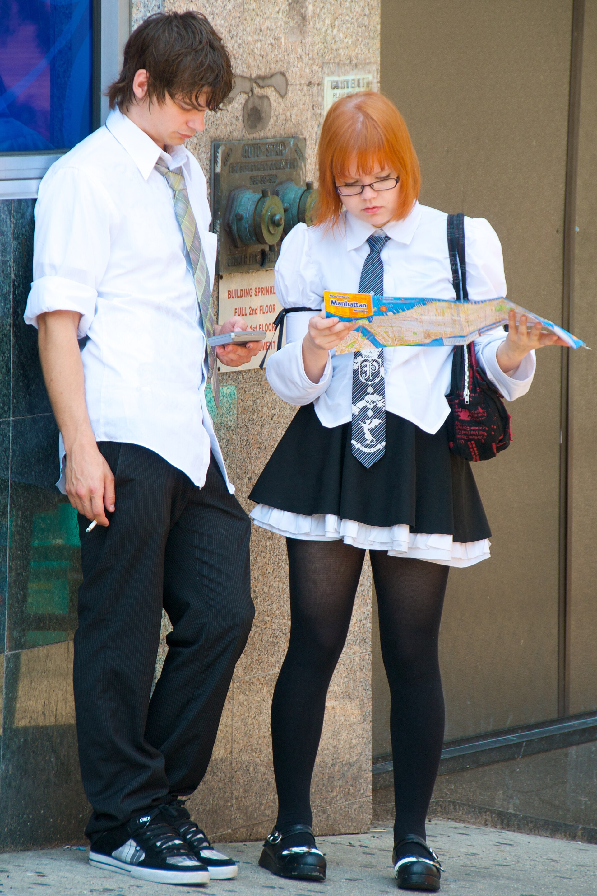 Two tourists checking a map together