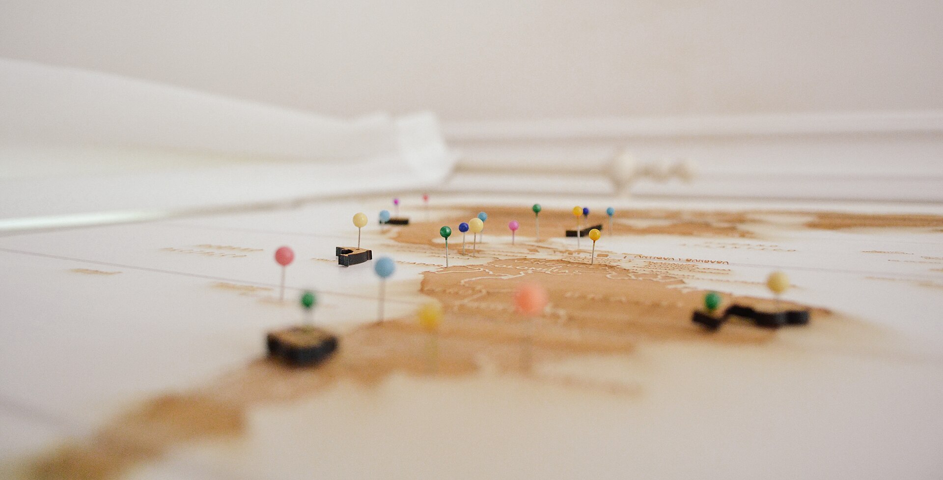Coloured pins marking places on a map