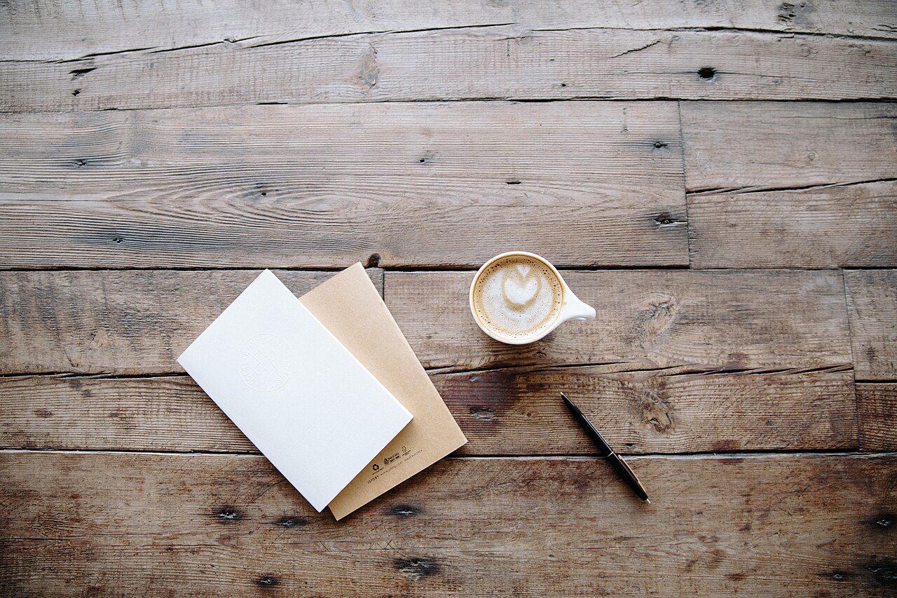 Coffee, notebooks and pen (Unsplash)